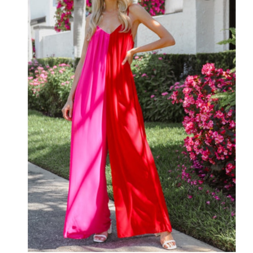 NWT Two faced jumpsuit. Adjustable straps with pockets